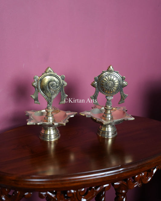 Premium Heavy Solid Brass Shankh &amp; Chakra Standing Lamp Pair – 10-Inch Traditional Tabletop Brass Diya Set with Sacred Vaishnava Motifs and Compact Pedestal Bases