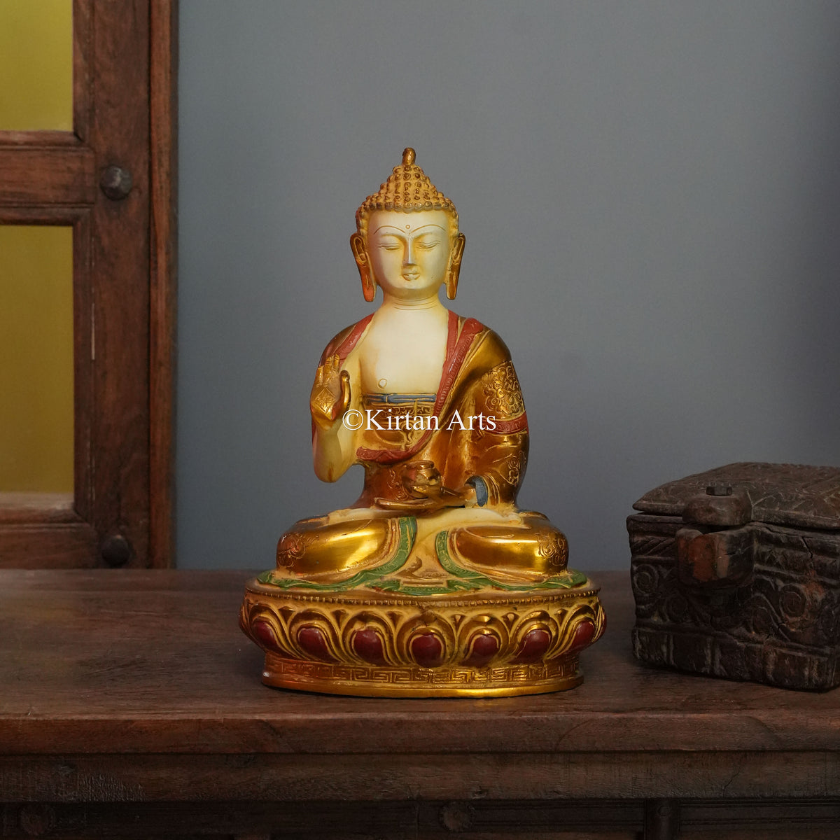 Ivory-Faced Brass Buddha with Gilded Robe and Red Trim